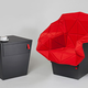 Illustration for article titled Fold Out Emergency Chair Hides Inside a Monolithic End Table
